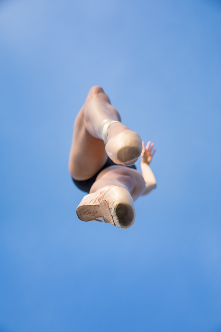 Professional ballet dancer photographed in toe shoes en pointe from below by fitness advertising photographer Robert Houser