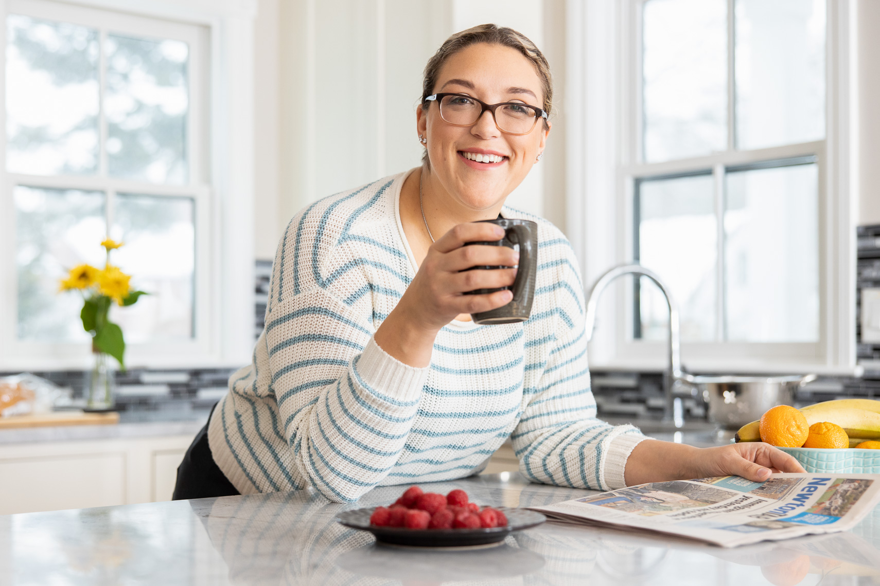 Portrait of a female patient in her kitchen drinking coffee by san francisco based healthcare advertising photographer robert houser